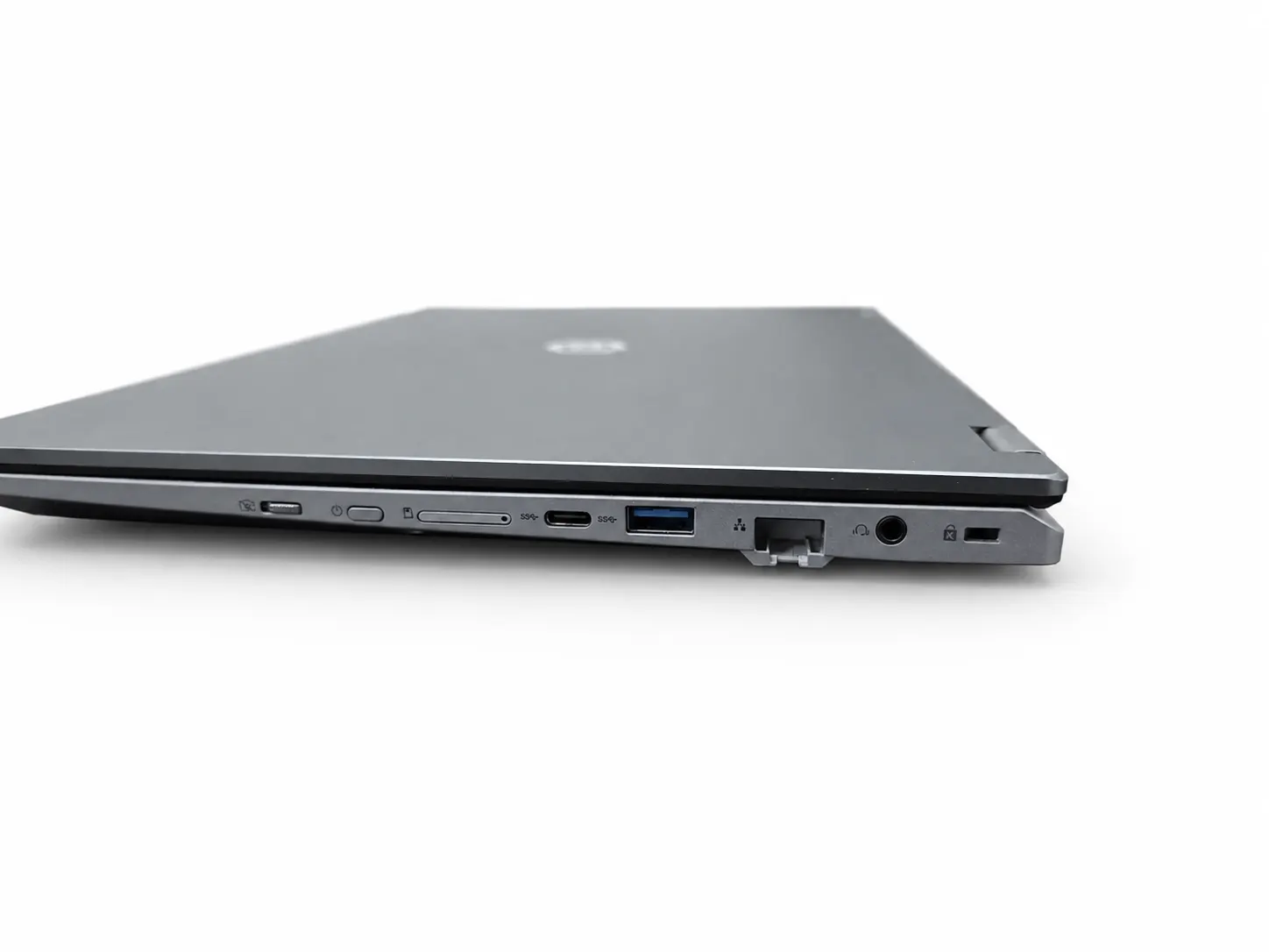 The other side of the closed laptop, with the network port and the headphone jack