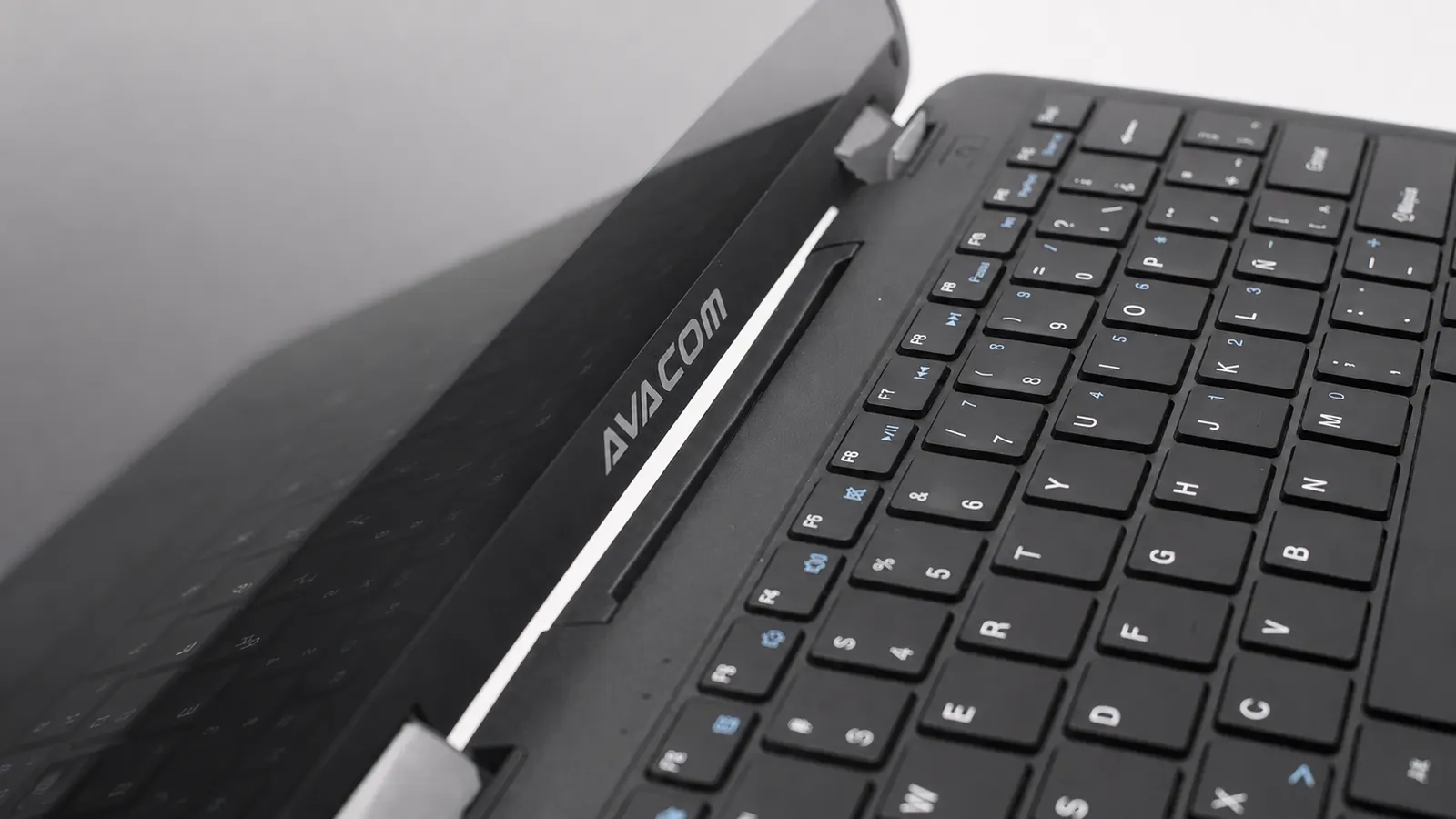 Close-up of the laptop's hinge and keyboard