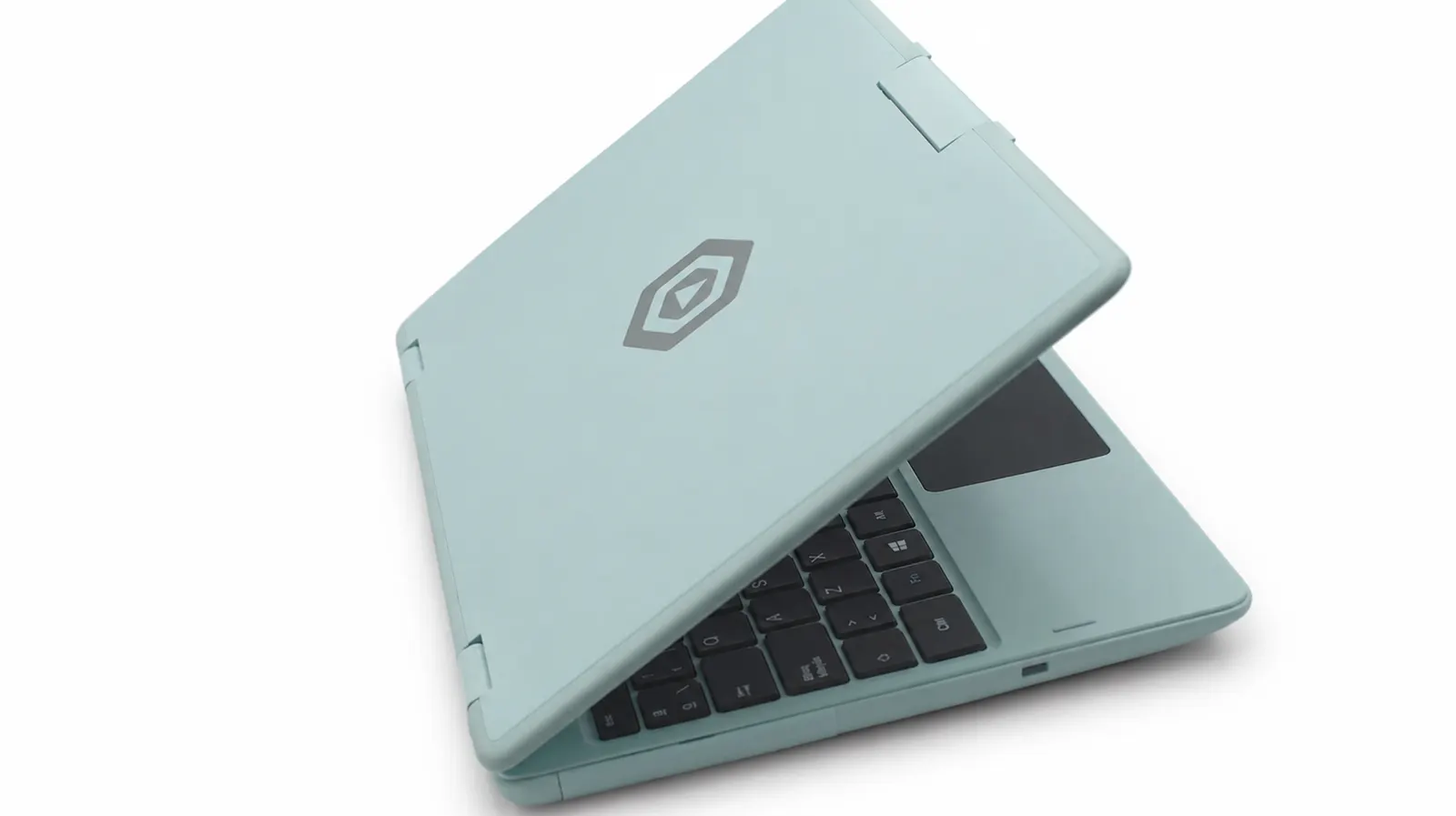 The laptop closed, in mint, seen at an angle